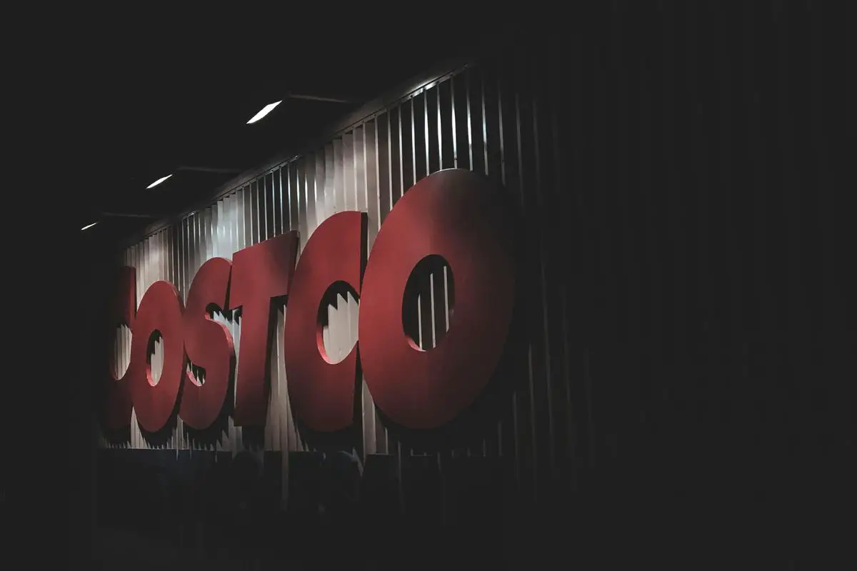 Image of 12 Costco Drive, showing the exterior of the store with shoppers entering and exiting.