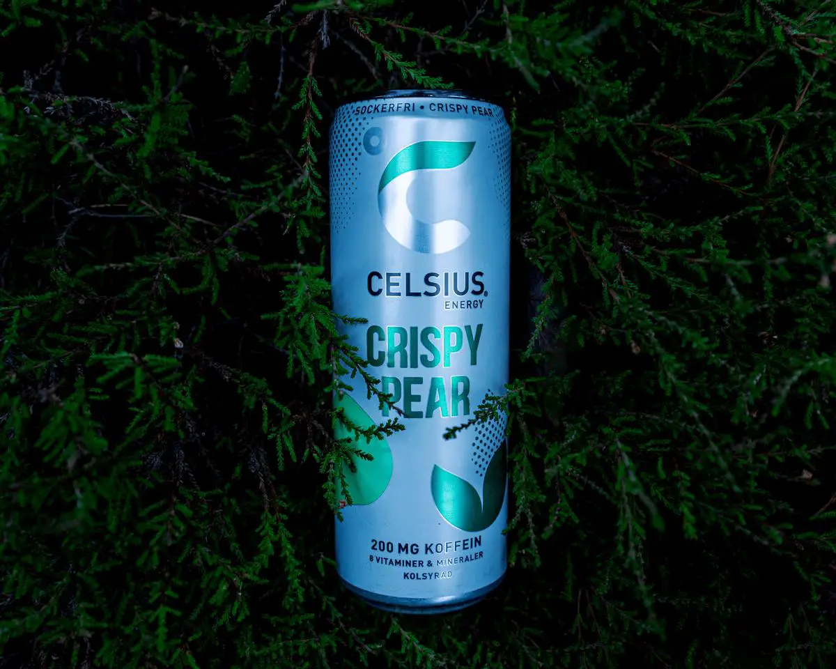 A can of Celsius Energy Drink with a burst of energy in the background