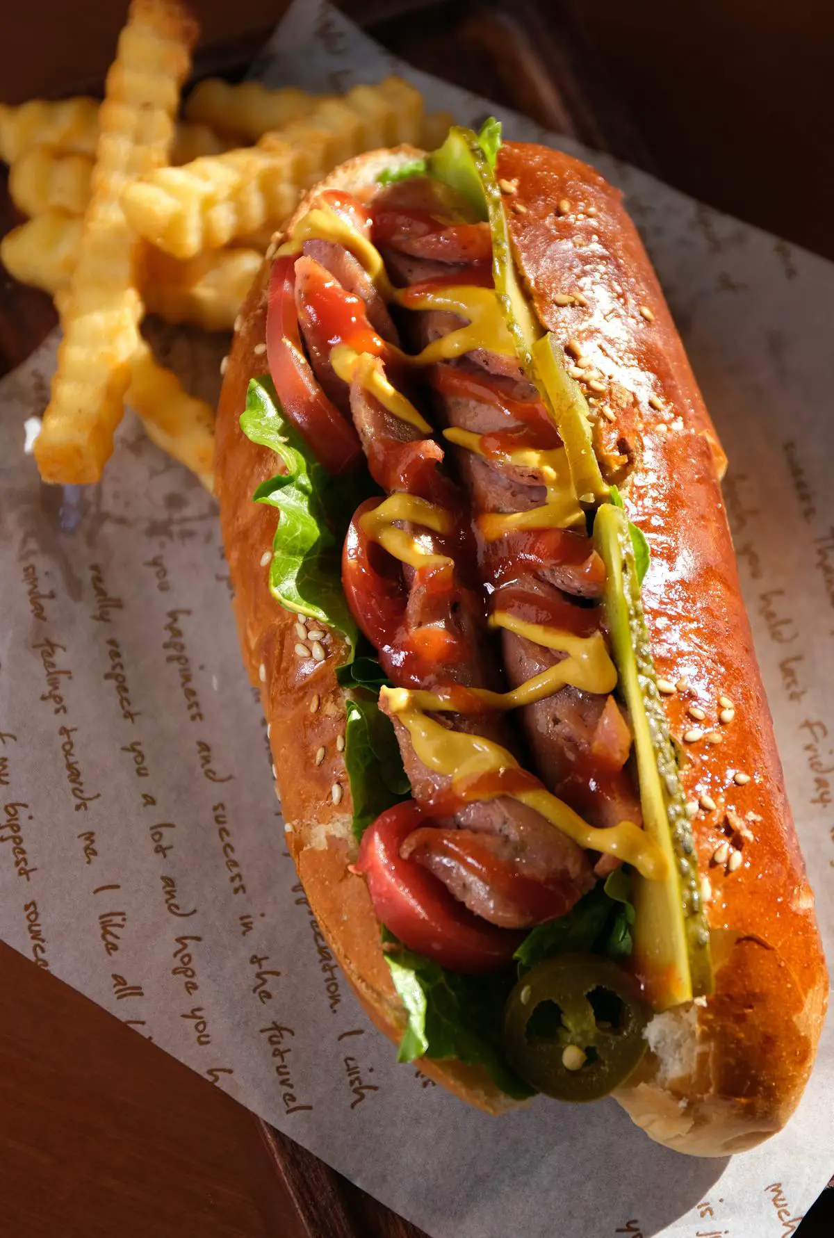 A close-up image of a Costco hot dog on a bun with ketchup and mustard.