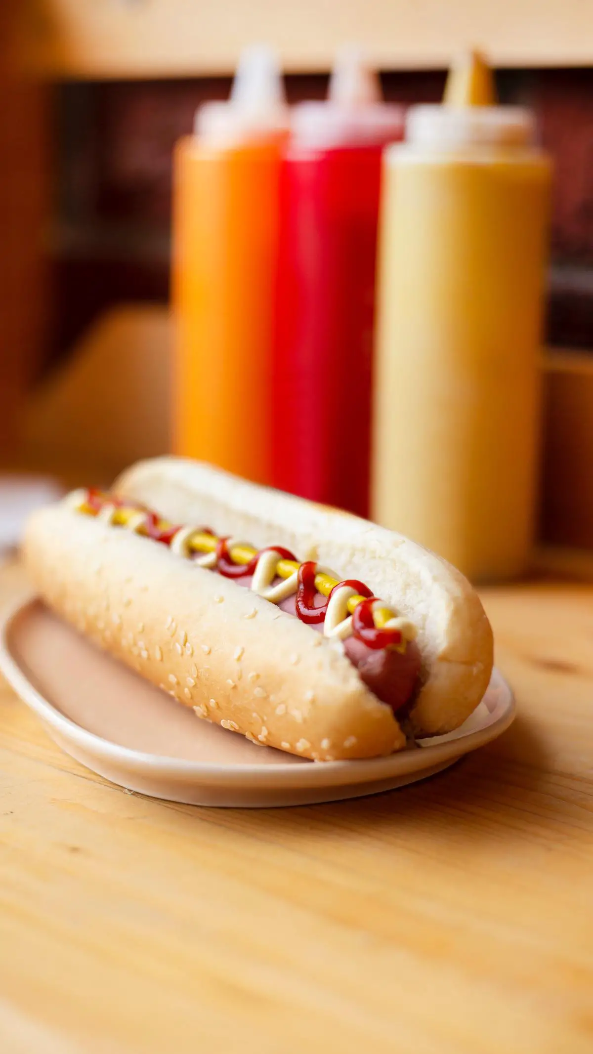 A picture of a hot dog with ketchup and mustard, a classic American food.