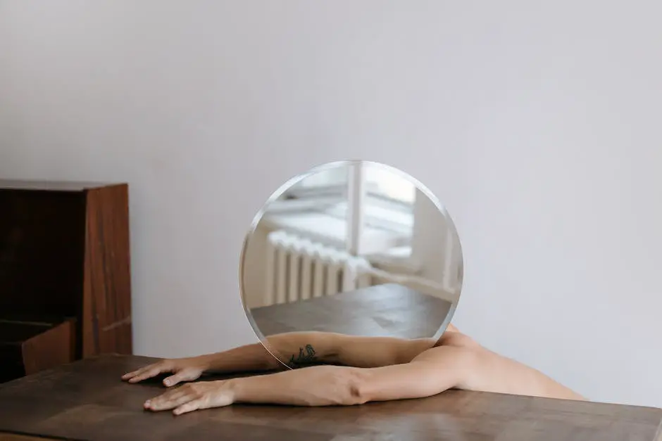 Hovet mirror hanging on a wall in a bedroom with light reflecting on it