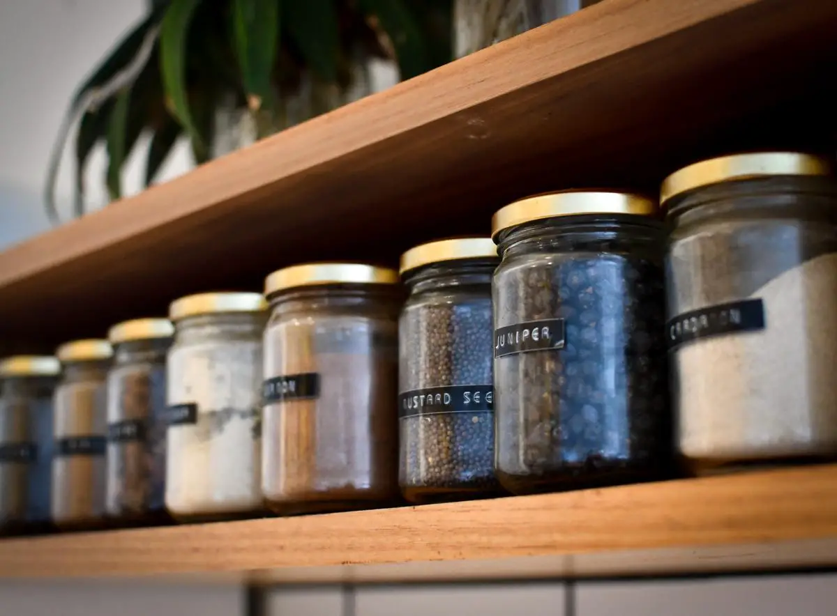An image of various spices displayed in jars, showcasing their vibrant colors and textures.