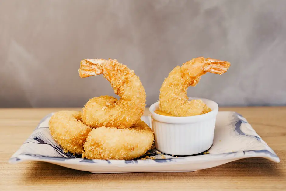 A delectable plate of Tempura Shrimp served with a side of dipping sauce.