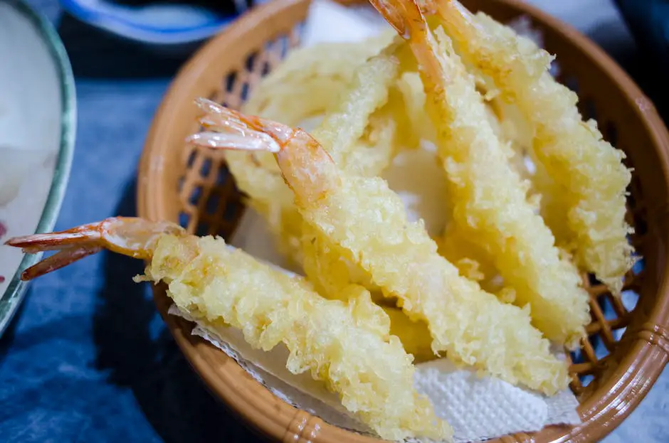A bowl of delicious Tempura Shrimp, capturing their golden-brown crispy exterior and succulent interior.