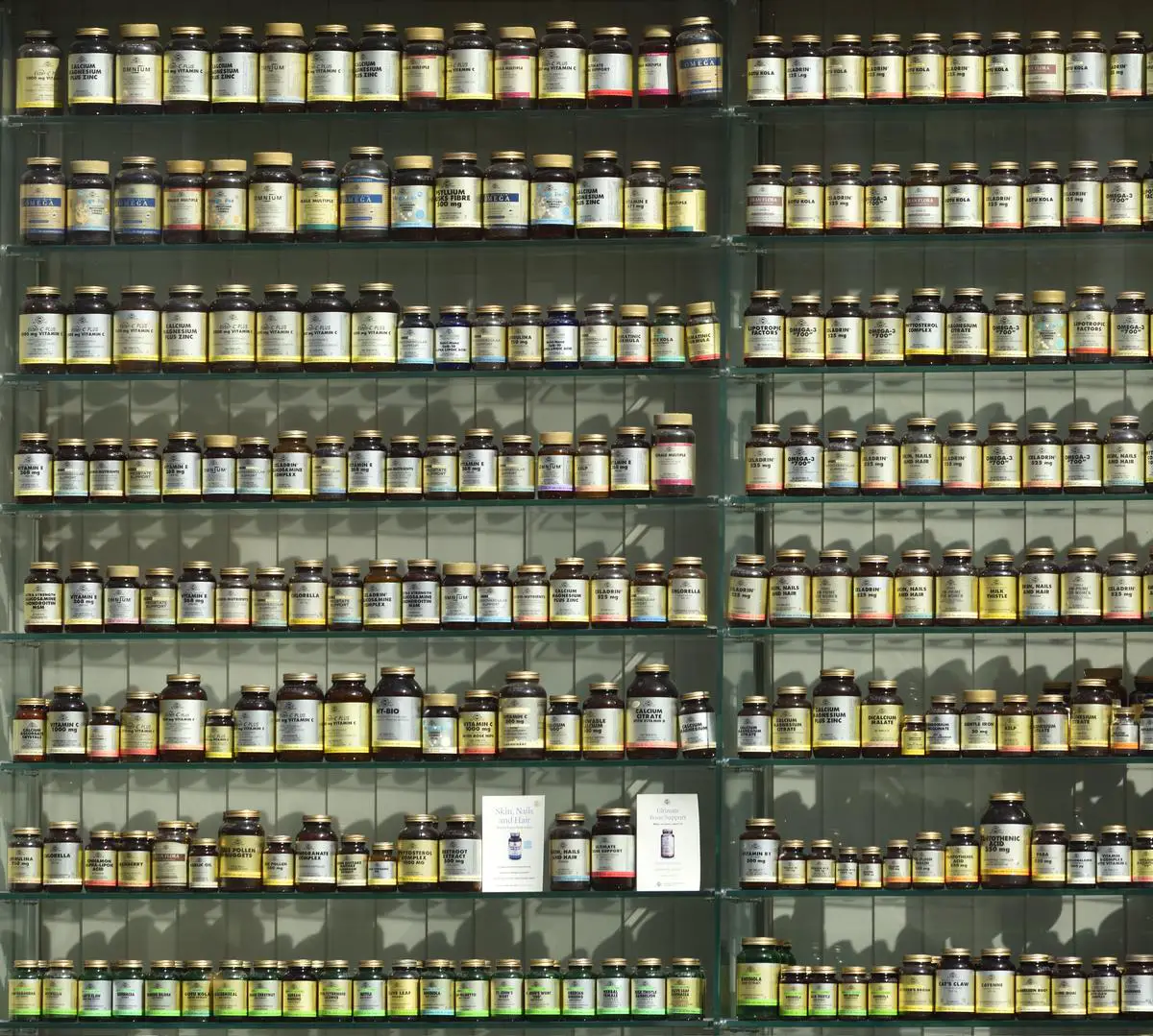 Image of a pharmacy shelf with medicine bottles, representing Costco Pharmacy's pricing overview.