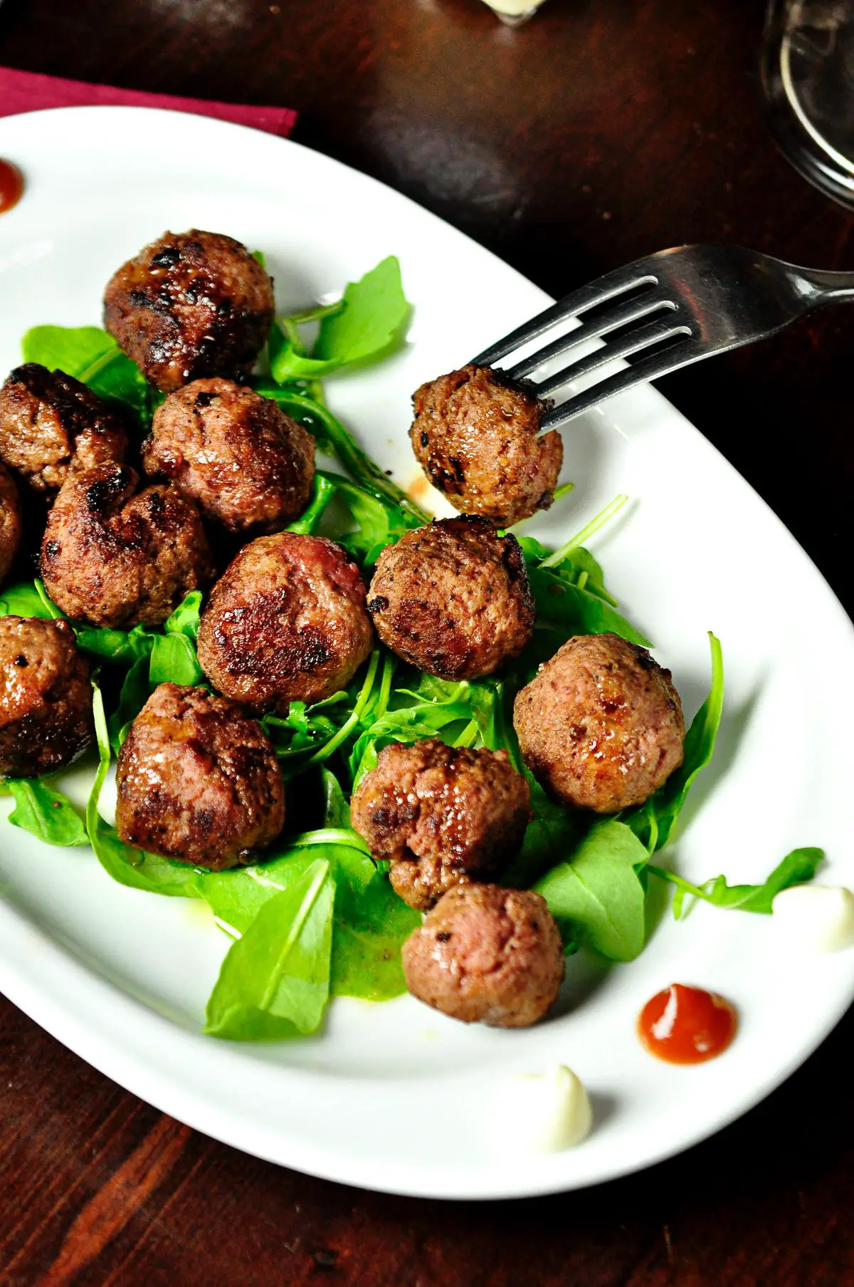A variety of fresh food items from IKEA's online food market, including meatballs, cheese, salmon, and vegetarian options.